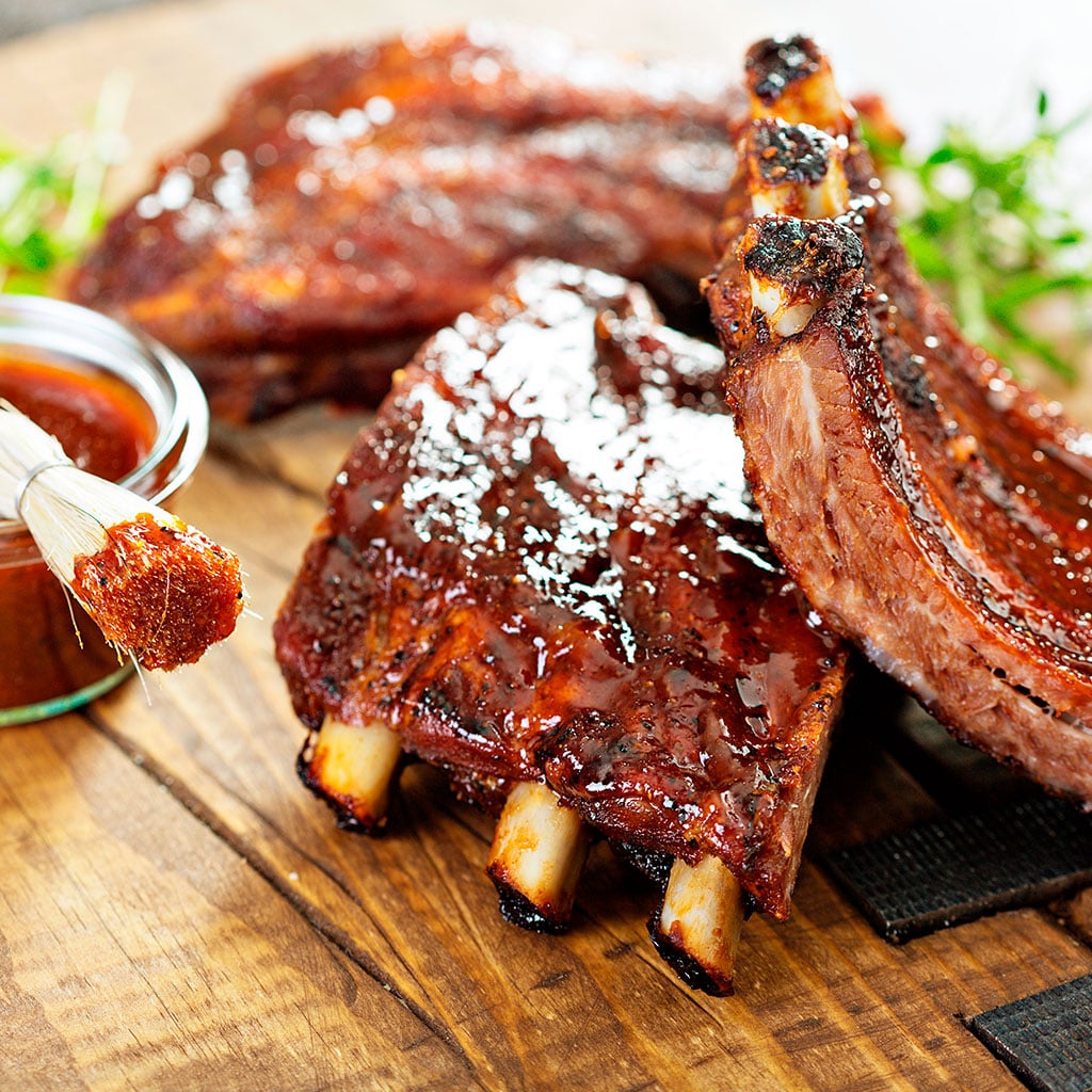 Costillitas de cerdo con salsa de tomate, curry y cerveza - Receta