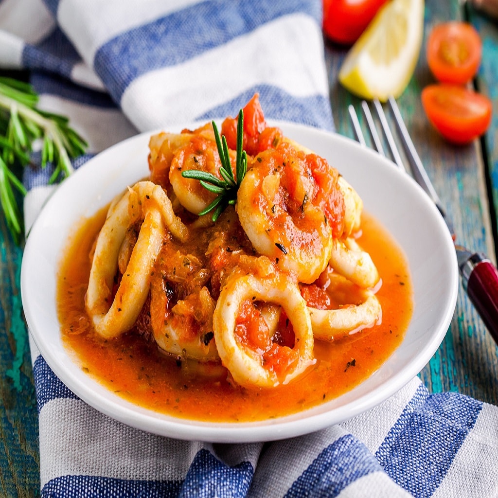 Stewed squid rings in tomato sauce for dinner