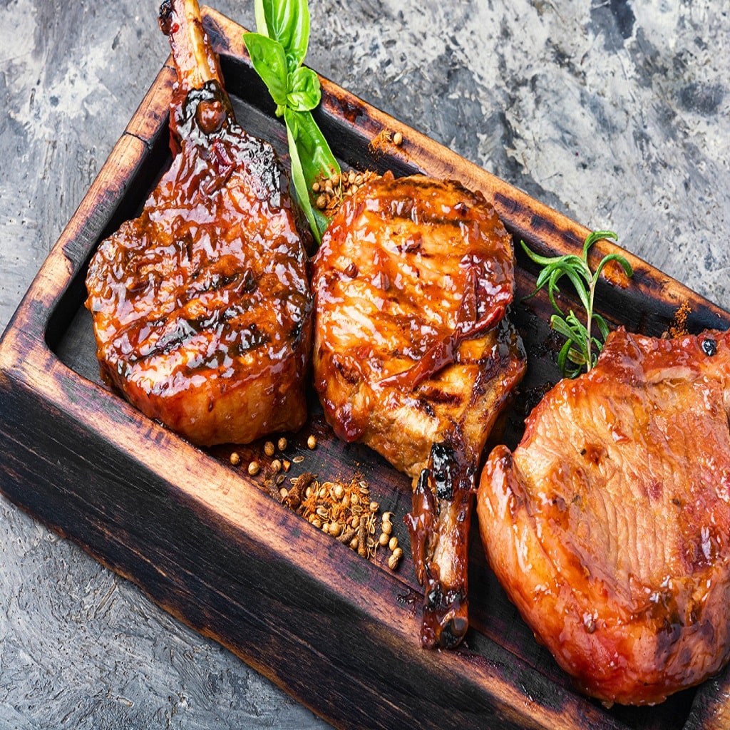 Spicy meat grilled spare ribs on wooden cutting board.Pork rack grilled